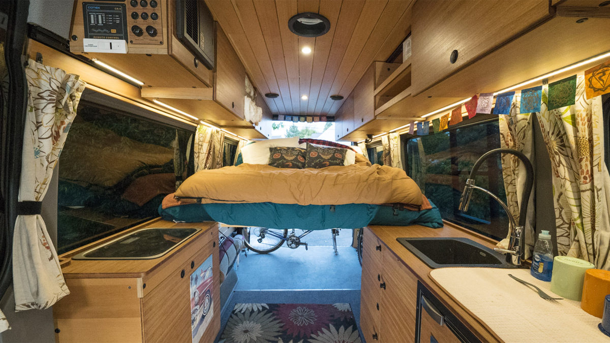 CreatID custom sprinter conversion kitchen cabinets with versatile abundant space for people, bikes, and gear