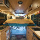 CreatID custom sprinter conversion kitchen cabinets with versatile abundant space for people, bikes, and gear